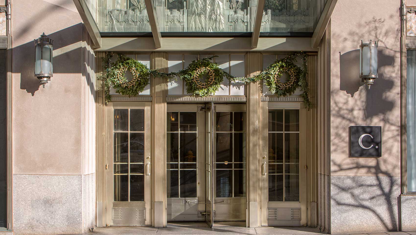 Kimpton Cardinal hotel entrance decorated with holiday wreaths