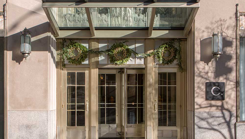 Holiday wreaths adorn the front entrance to the Cardinal